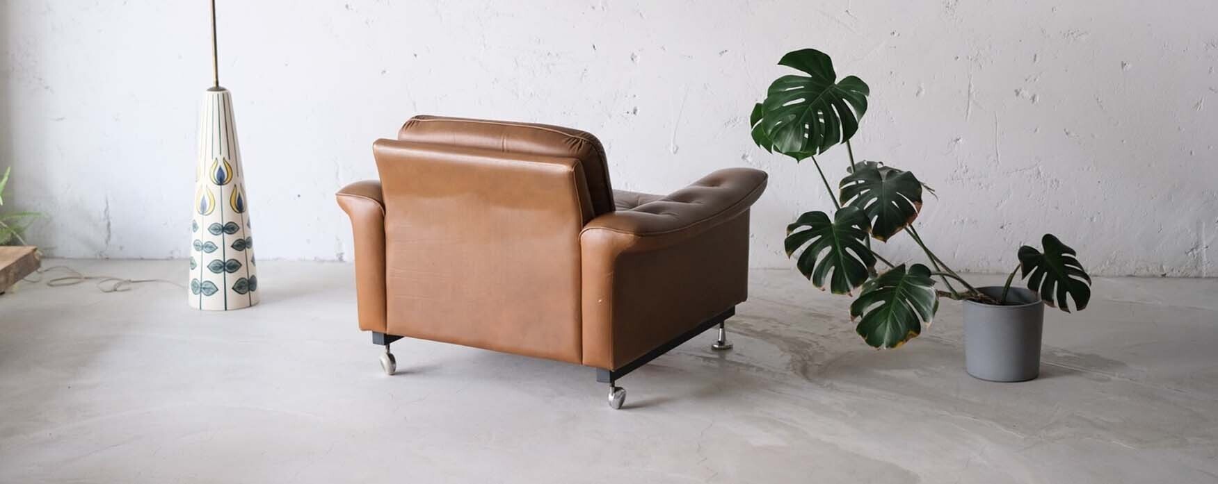 丹麥帶輪皮革單人沙發